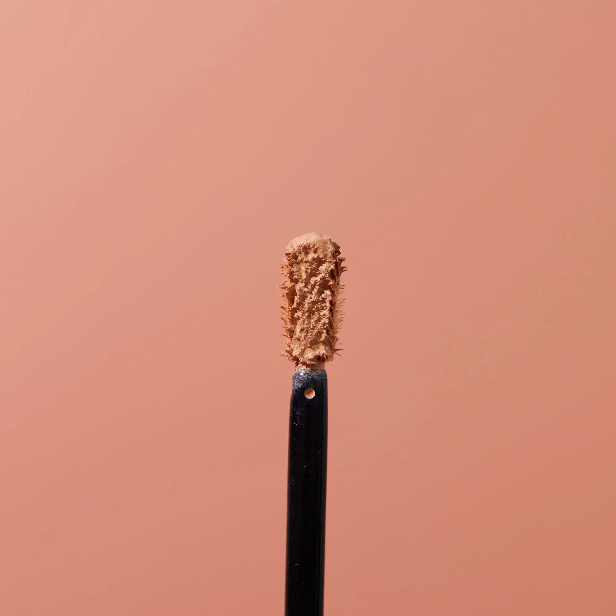 applicateur correcteur ouvert fond rose