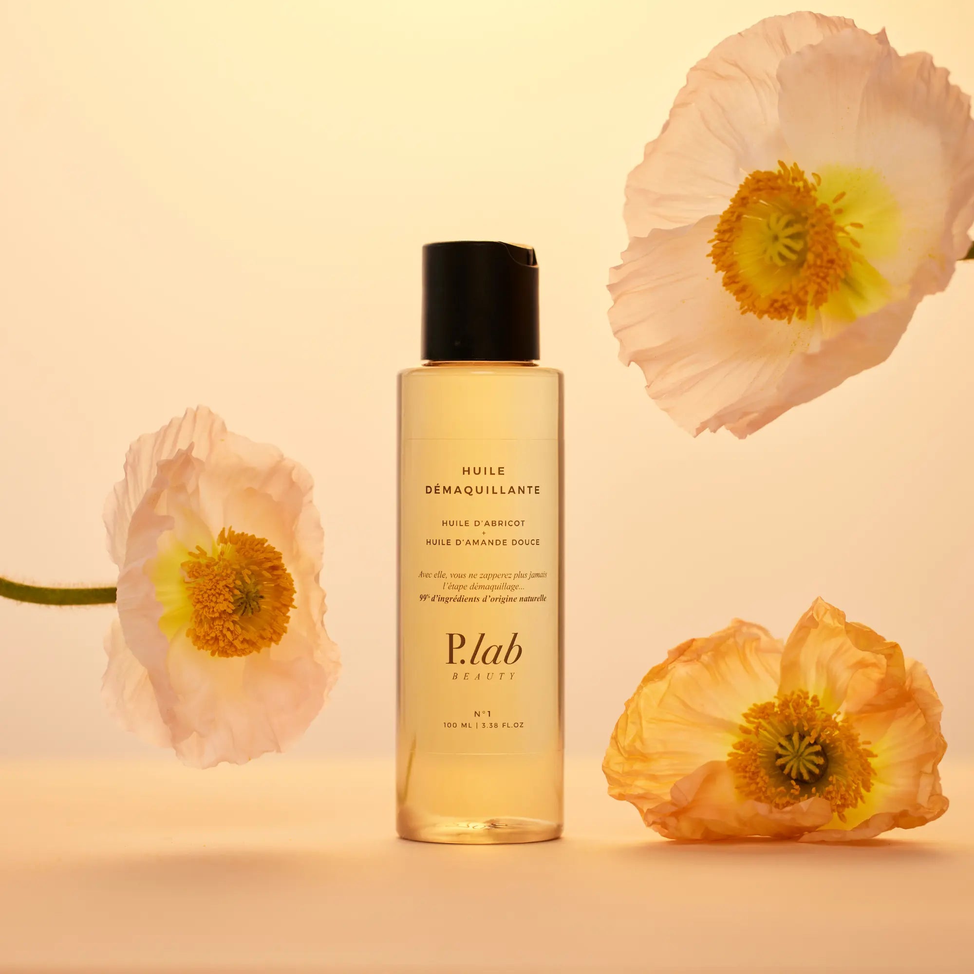 huile démaquillante jaune fond orange et fleurs