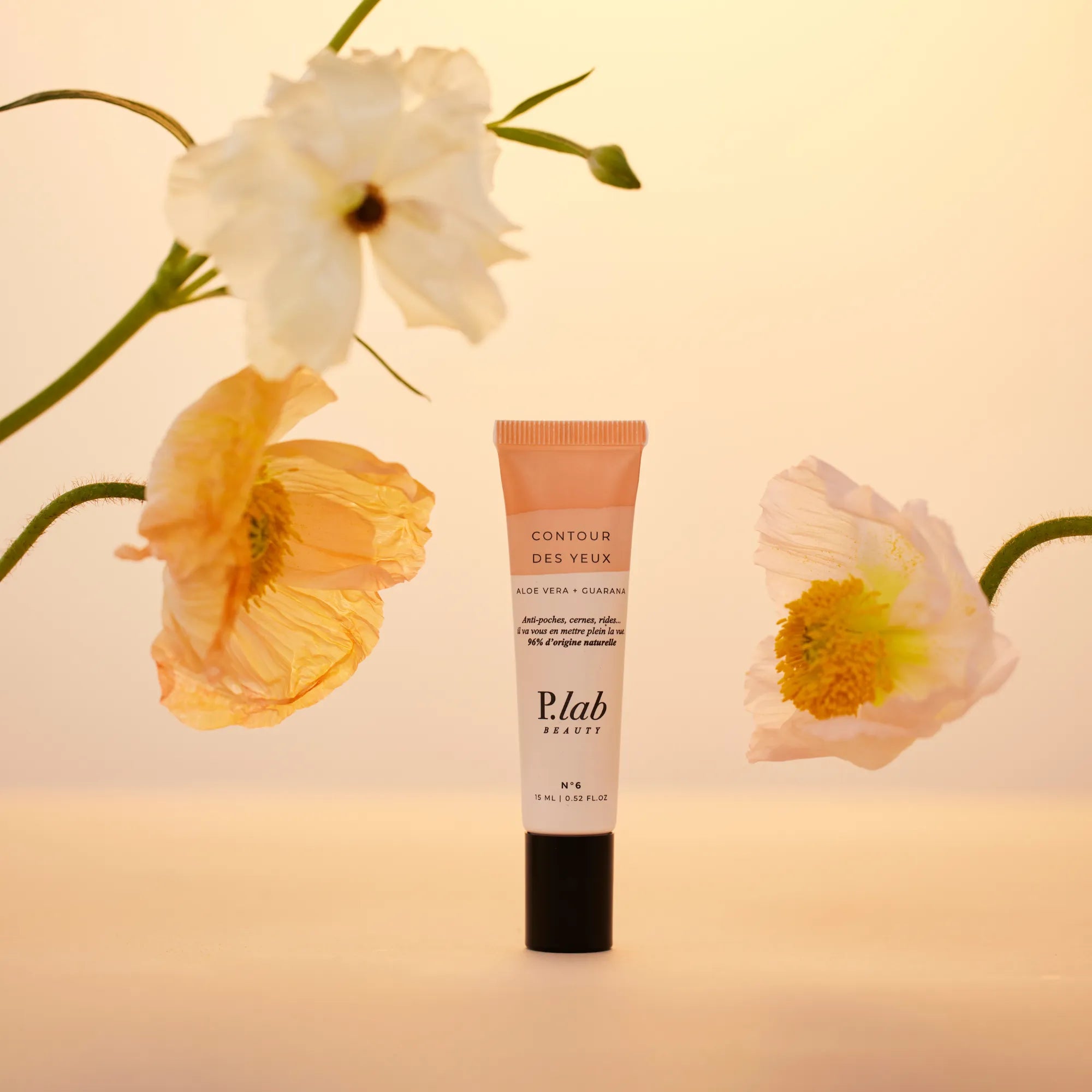 contour des yeux roll on fond rose / orange et fleurs