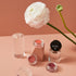 blushs crème ouverts fond rose fleur blanche