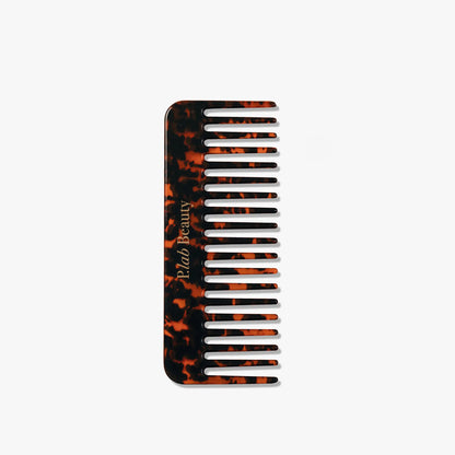 peigne cheveux écailles fond blanc