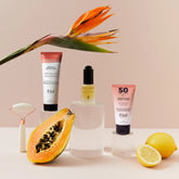 routine soins anti tache avec papaye et citron, fond rose et fleur